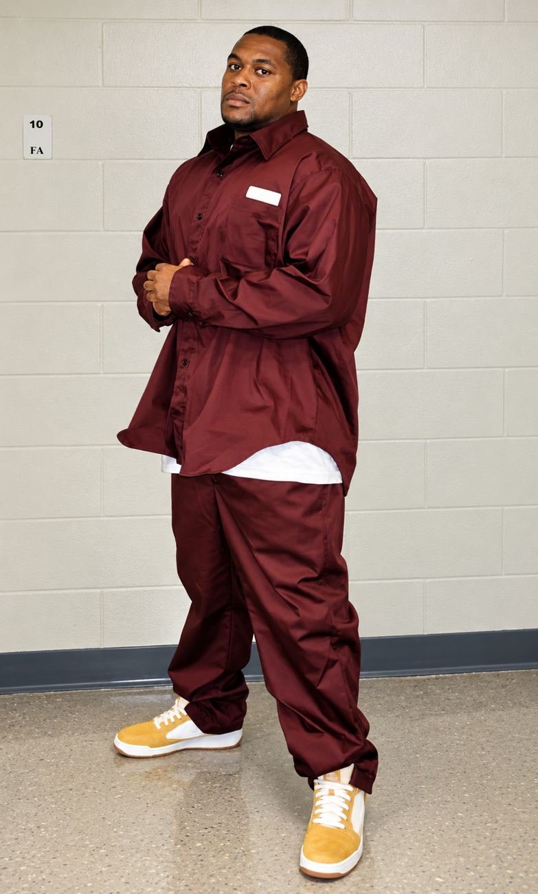 Randy D. Petty standing in a burgundy uniform